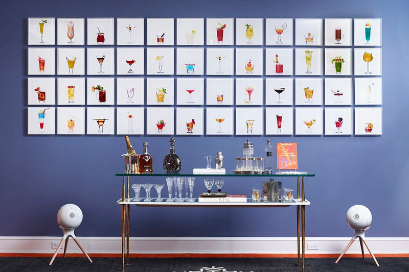 Limited Edition Cocktail Portraits on display over a bar